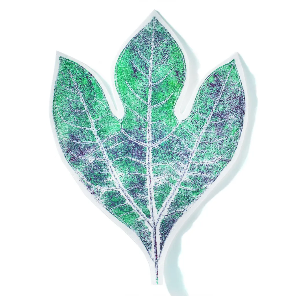 Learn to print with leaves to create fabric art like this!