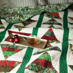 Love of Quilting Nov/Dec 2021 cover photo featuring Peggy Gelbrich’s festive Tannenbaum Tumble